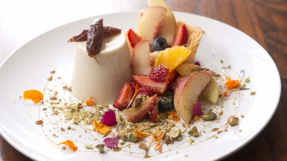 Goat's milk and date panna cotta with seasonal fruit, kataifi pastry and pistachios.