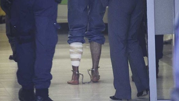 Bitten ...  Mr Naden's leg is bandaged after he was bitten by Chuck the police dog during the arrest operation.