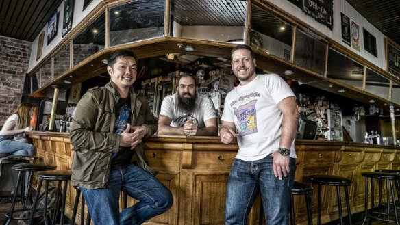 Burgeoining burgers: From left, Jeff Wong, the Curtin Hotel's Benjamin Russell, and Daniel Wilson in Carlton.