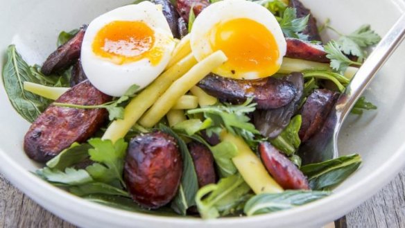 Grilled chorizo salad with soft-boiled egg and butter beans.