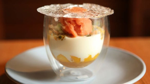 Verrine with guava sorbet, tropical fruit, whipped coconut cream and sugar 'glass'.
