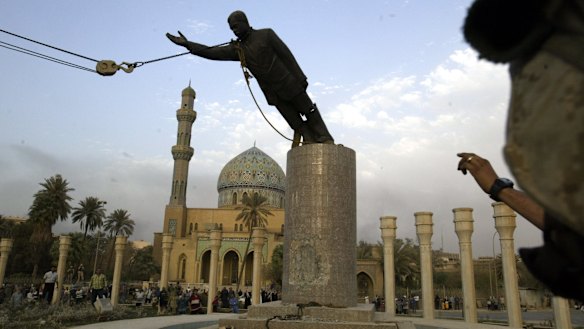 The statue of Saddam Hussein being toppled in Firdaus Square, downtown Bagdhad in 2003. The sledgehammer damage is visible on the base.