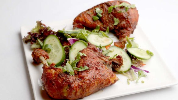 The signature Burrpie chicken is among the nearly 100 dishes on the menu.