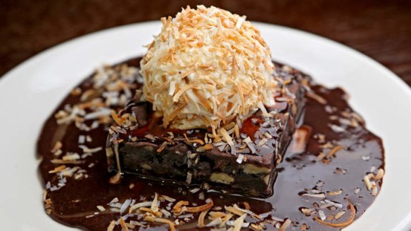Chocolate fudge brownie sundae with toasted coconut.