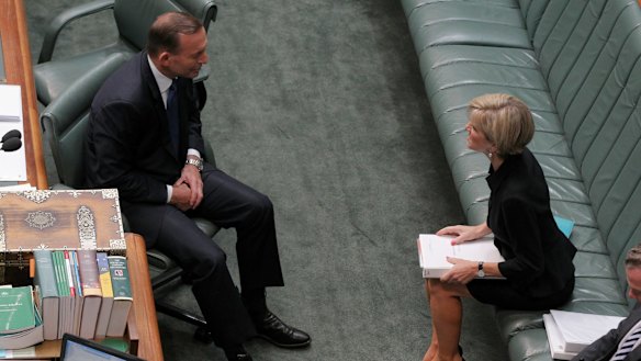 Prime Minister Tony Abbott and Foreign Affairs Minister Julie Bishop in discussion ahead of question time  on Tuesday.