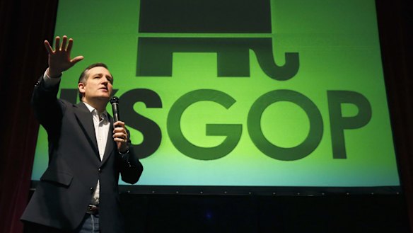 Republican presidential candidate Ted Cruz raises his support base at a caucus site in Kansas.
