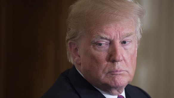 Trump denies he knew about his lawyer's payment to porn star Stormy Daniels.