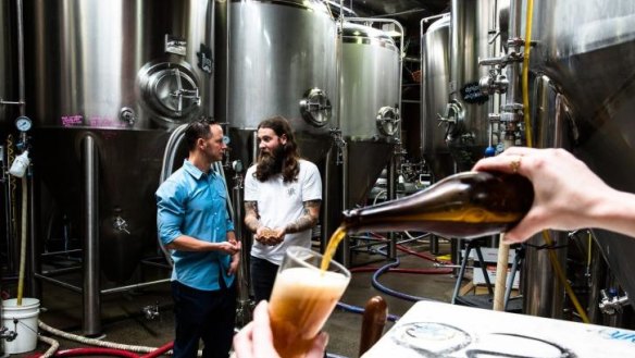 Jake Steele, solar energy specialist, left, and Oscar McMahon, co-owner and brewer from Young Henrys. 