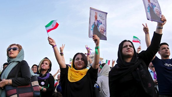 Supporters of Iran's President Hassan Rouhani, who is running for a second term in office, attend a campaign rally in Tehran, Iran.