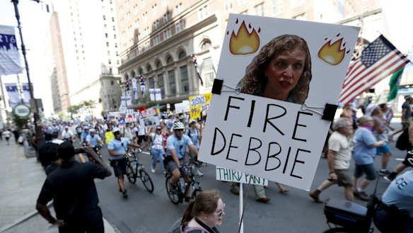 Supporters of Vermont senator  Bernie Sanders call for the sacking of Debbie Wasserman Schultz in Philadelphia on Sunday.  