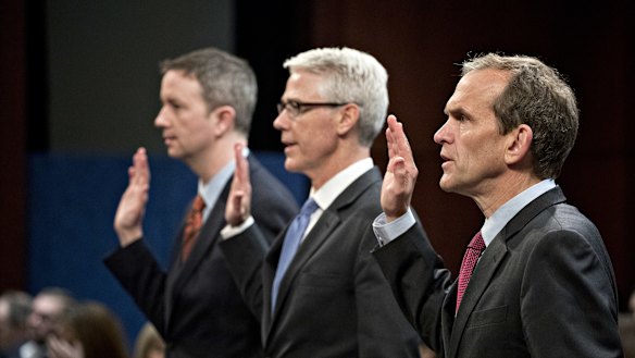 Kent Walker, vice president and general counsel with Google Inc., right, swears with other tech executives in to a House Intelligence Committee hearing in Washington,