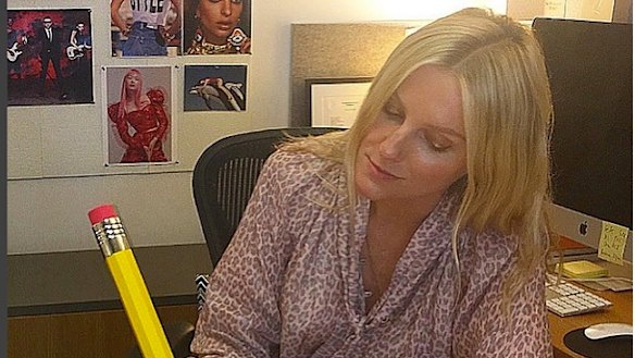 "Just editing! Don't mind me!" Brown hams it up in her New York office. 