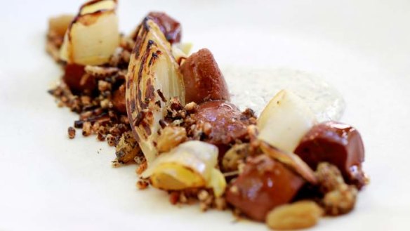 Lamb tongues with endive, pickled green raisins and puffed black rice.