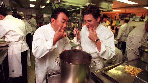 Charlie Trotter and Tetsuya Wakuda cook together in 1999.