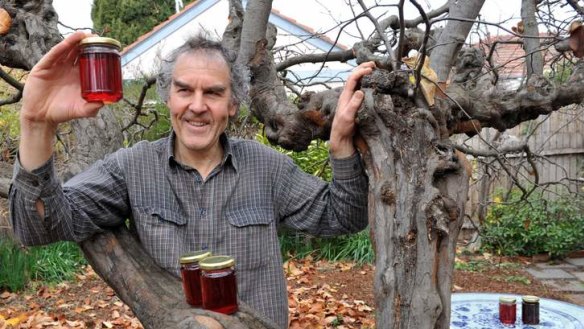 Rupert Summerson with the gnarled quince tree and his homemade quince jelly.