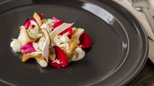 A dish comprising rose petals, oyster mushrooms, beets, macadamias and rose vinegar.