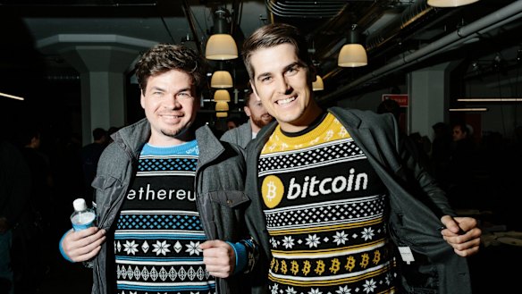 Crypto mania: Fans wearing bitcoin- and Ethereum-themed crypto jumpers.