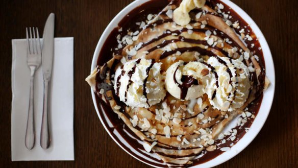 Colossal: A crepe with chocolate, banana, whipped cream, almonds and ice-cream.