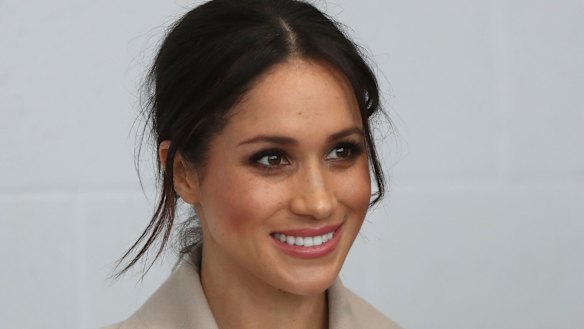 Meghan Markle  smiles during a visit with Prince Harry to the  Eikon Exhibition Centre in Lisburn, Northern Ireland.