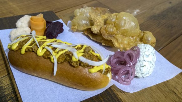Signature dishes: The gribenes (fried chicken skins) and smoked hotdog.