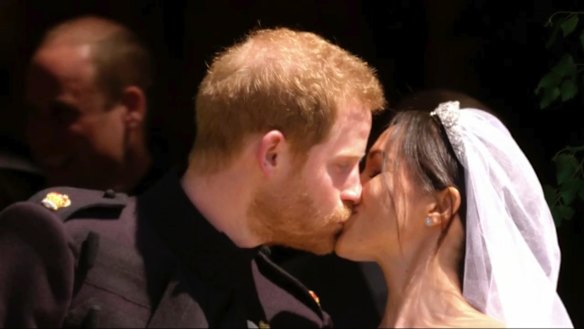 The moment the world was waiting for: Prince Harry and Meghan Markle kiss after their wedding at St George's Chapel in Windsor Castle.
