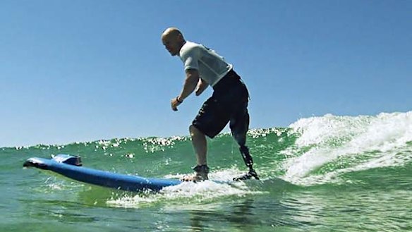 Swell time... shark attack victim Paul de Gelder hits the waves.
