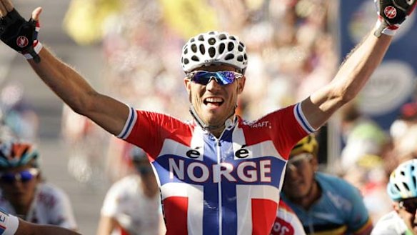 The Gold of Thunder . . Thor Hushovd celebrates as he crosses the finish line.