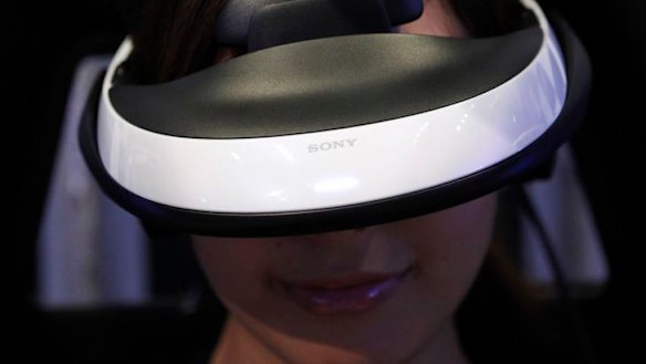 A model demonstrates using Sony's head mounted display "Personal 3D Viewer HMZ-T1" at its product launch in Tokyo.