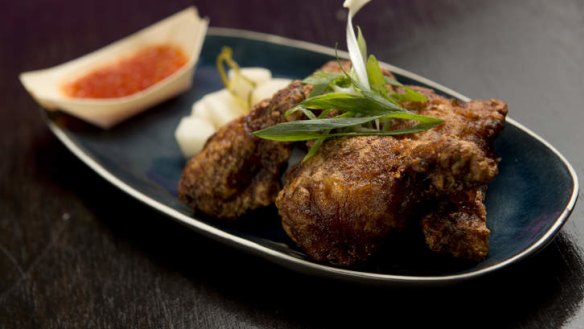 Lightly-spiced fried chicken comes with tangy dipping sauce.