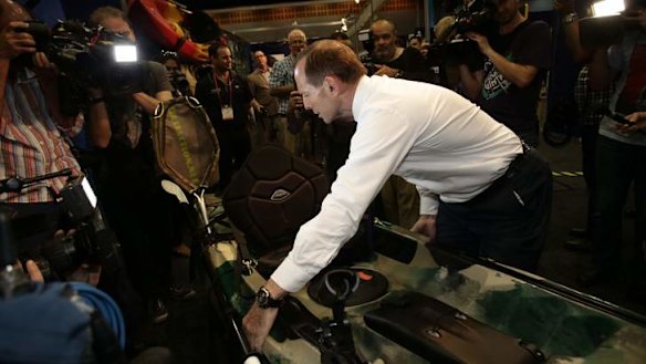 Opposition leader Tony Abbott visits the Australian Fishing Trade Show on the  Gold Coast, Queensland, on Monday.