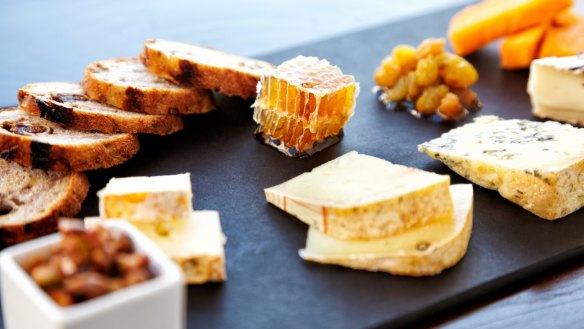 Honey and nuts complement the flavours on a cheese platter.