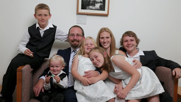 AMEP Senator Ricky Muir and partner Kerrie-Anne, together with their five children (L-R) William, Tristan, Tarja, Phoenix and Dylan in his office in Canberra on Thursday.