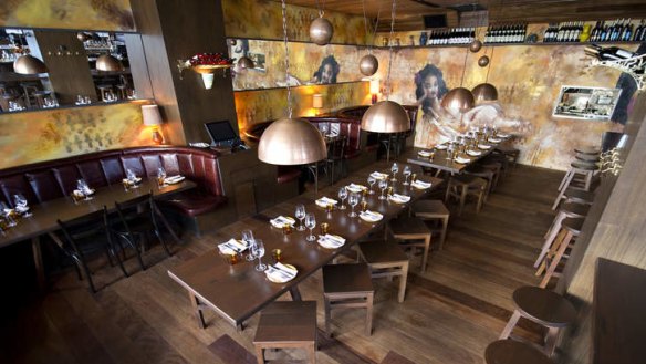 Gordita's interior features copper lights and leather booths.