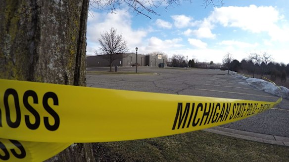 Police tape surrounds one of the crime scenes in Kalamazoo, Michigan on Sunday.