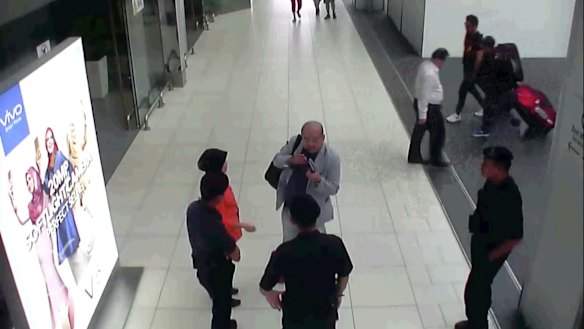 CCTV footage shows Kim Jong-nam speaking with Kuala Lumpur airport officials after the attack.