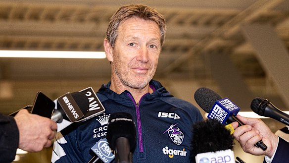 Decisions to make: Storm coach Craig Bellamy speaks to the media at Melbourne Airport.