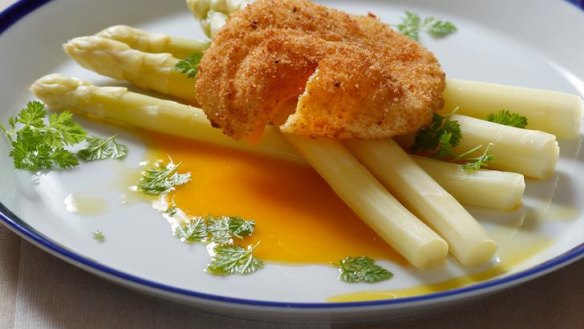 Poached white asparagus with crunchy egg and chervil.