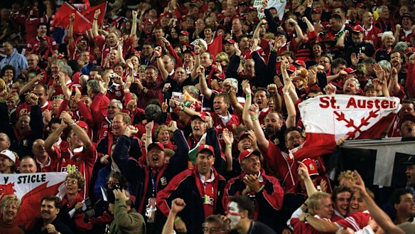 Red then yellow: Lions fans turned Brisbane red in 2001, but the stadiums quickly turned gold after the first Test.