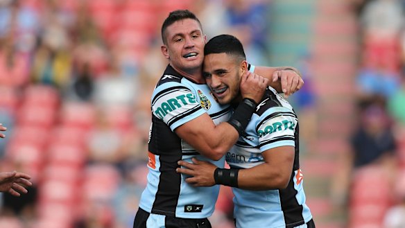 Four-try hero: Valentine Holmes, right, celebrates with Chris Heighington.