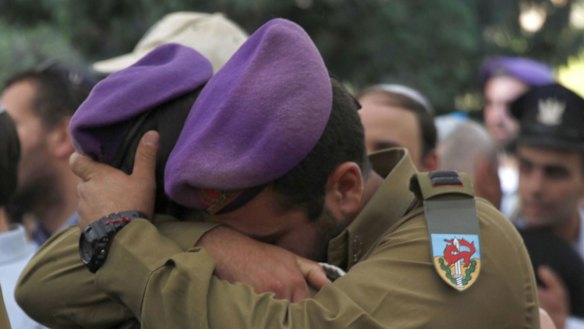 Comrades of Hadar Goldin mourn during his funeral on August 3.