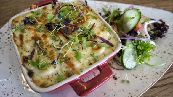 Nutmeg-laced moussaka (minced beef and bechamel layered bake).