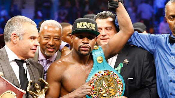 Unanimous: Floyd Mayweather jnr celebrates his win over Manny Pacquaio.