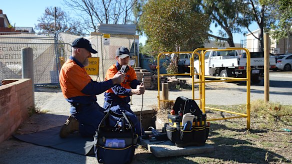 Ant Rees (L) Emmett Fenlon (R) install the NBN in Subiaco.
