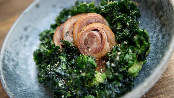 Slow-cooked spring lamb with crushed fresh peas and kale chips.