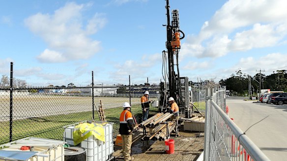 Transurban site investigators are seen drilling on the proposed Western Distributor toll road in Yarraville.