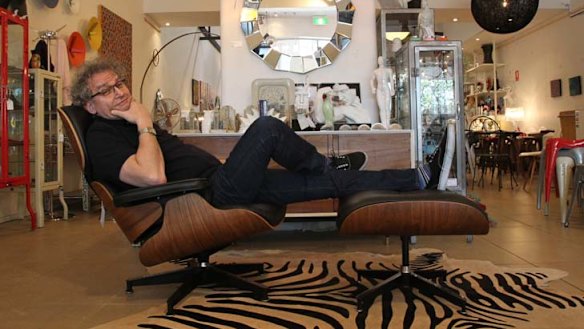Battle of the names ... retailer Adam Drexler and a replica Eames lounge chair and ottoman in his Matt Blatt store in Paddington.