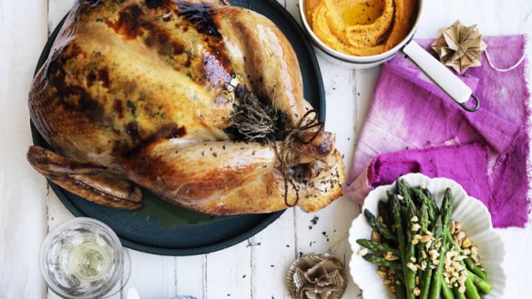 Christmas with all the trimmings: Roast turkey with stuffing and sweet potato puree (top right) and asparagus with almonds.