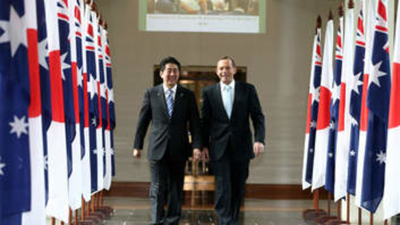 In lockstep: Japanese Prime Minister Shinzo Abe and Prime Minister Tony Abbott leave the House of Representatives after a joint address to parliament.