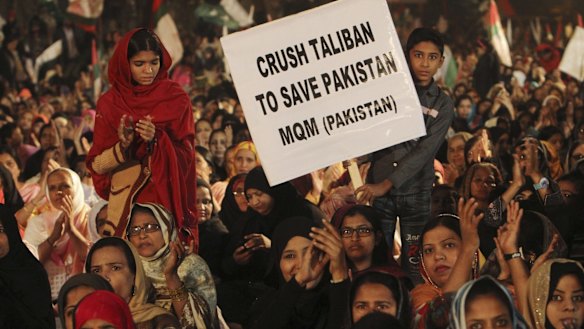 Supporters of Pakistan's MQM political party call for harsh measures against the Taliban at a rally in Karachi on Friday.
