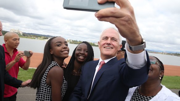 Malcolm Turnbull takes a selfie with new Australian citizens Lydia Banda-Mukuka and Chilandu Kalobi Chilaika on Australia Day last year.